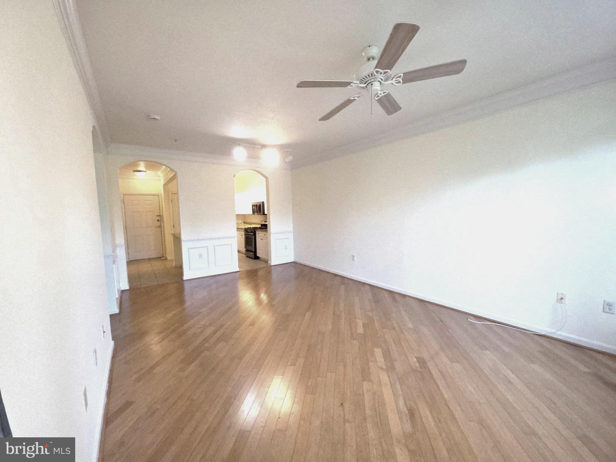 7 Booth Street, Unit 308 Gaithersburg, MD 20878 - Photo 5 of 21 a view of an empty room and wooden floor