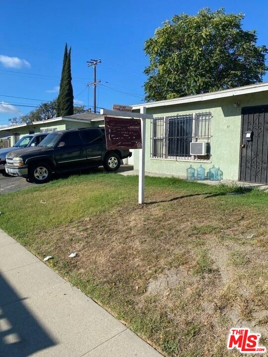 1400 West 130th Street Compton, CA 90222 - Photo 14 of 14 a front view of a house with garden
