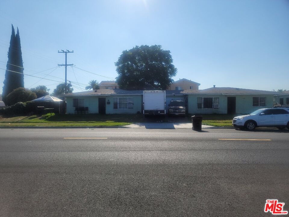 1400 West 130th Street Compton, CA 90222 - Photo 3 of 14 a house view with a big yard