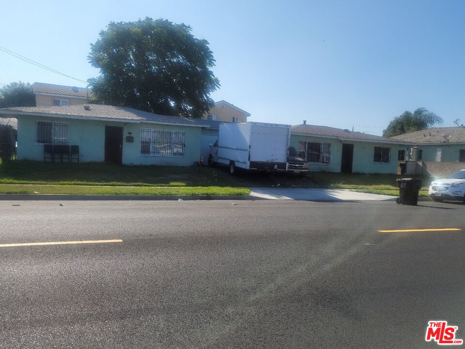 1400 West 130th Street Compton, CA 90222 - Photo 4 of 14 a living room with furniture and a fireplace