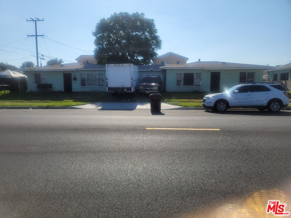 1400 West 130th Street Compton, CA 90222 - Photo 5 of 14 a view of a car parked in front of a house