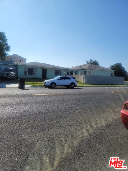 1400 West 130th Street Compton, CA 90222 - Photo 6 of 14 a car parked on the side of the road