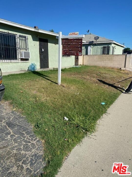 1400 West 130th Street Compton, CA 90222 - Photo 7 of 14 a front view of a house with garden