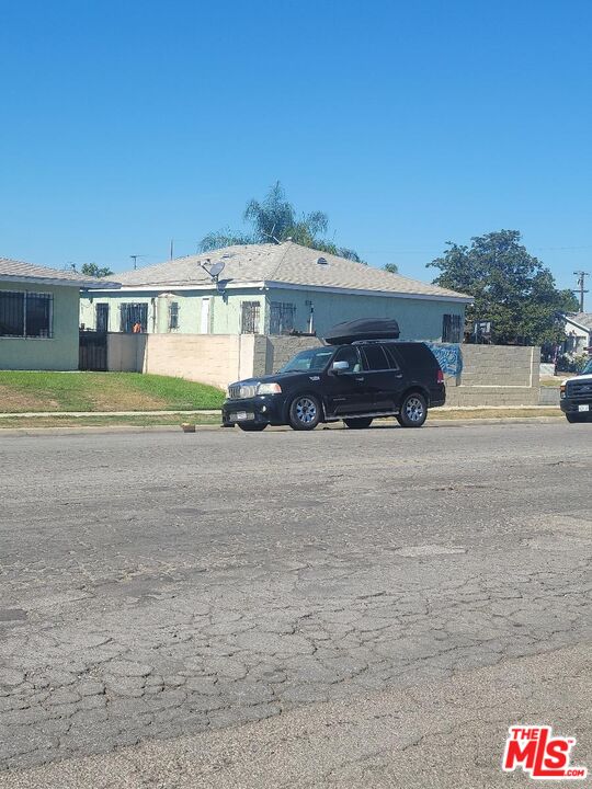 1400 West 130th Street Compton, CA 90222 - Photo 8 of 14 a car parked in front of a house