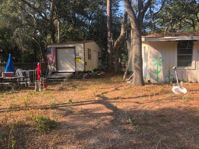 141 Sally Lane Santa Rosa Beach, FL 32459 - Photo 2 of 4 a view of a house with backyard and snow