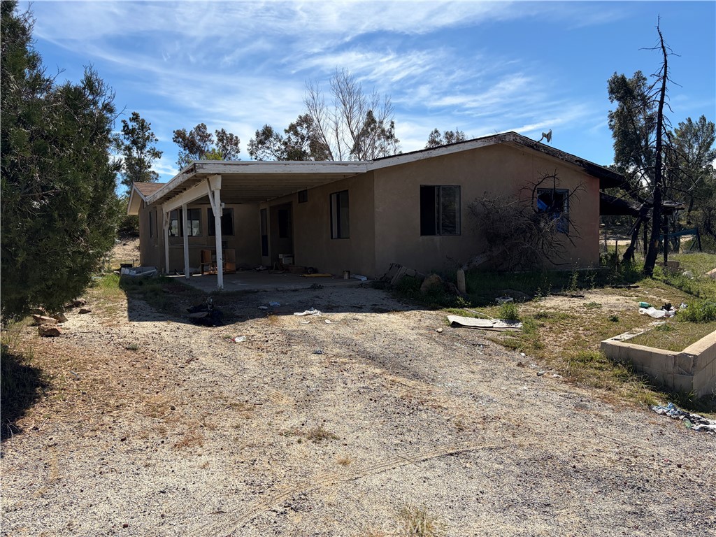 39175 Boulder Way Anza, CA 92539 - Photo 13 of 60 a front view of a house with a yard covered in snow