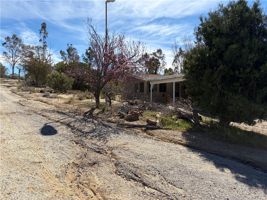 39175 Boulder Way Anza, CA 92539 - Photo 25 of 60 a view of a house with a yard and sitting area