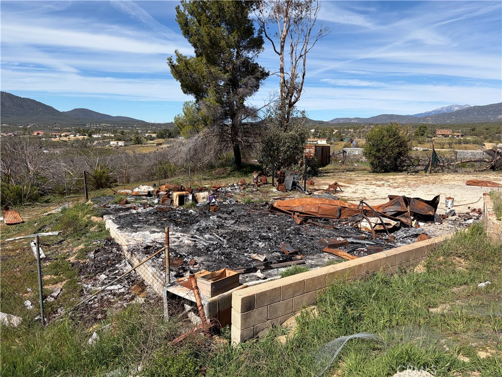 39175 Boulder Way Anza, CA 92539 - Photo 27 of 60 a view of a backyard with a table and chairs