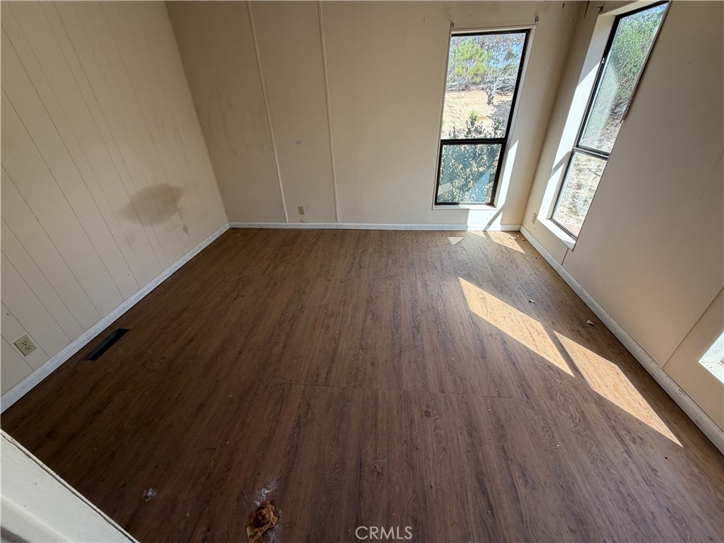 39175 Boulder Way Anza, CA 92539 - Photo 44 of 60 a view of an empty room and wooden floor