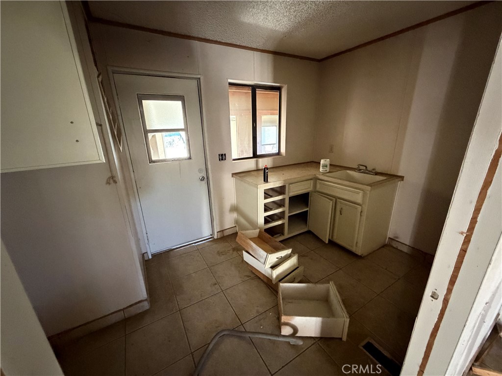 39175 Boulder Way Anza, CA 92539 - Photo 46 of 60 wooden floor and chair in a hall with wooden floor