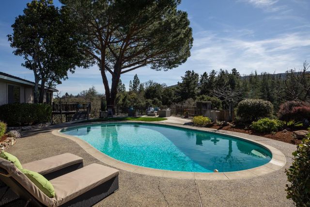 a view of a swimming pool with a patio