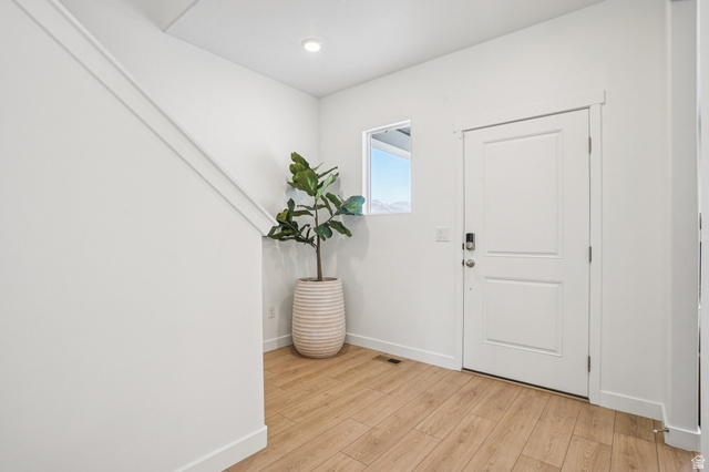 2097 North Ostler Peak Road, Unit 115 Heber City, UT 84032 - Photo 21 of 33 Entryway featuring light wood-finish flooring and white baseboards