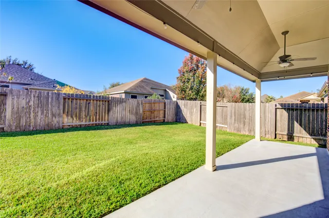 a view of a house with a yard porch and sitting area