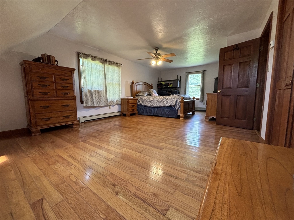 924 Walnut Plain Road Rochester, MA 02770 - Photo 21 of 36 a view of livingroom with furniture and chandelier