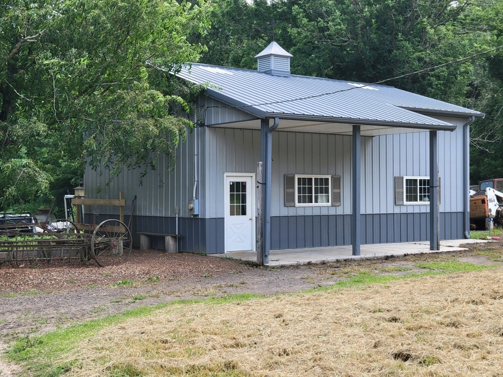 924 Walnut Plain Road Rochester, MA 02770 - Photo 28 of 36 a front view of a house with a yard