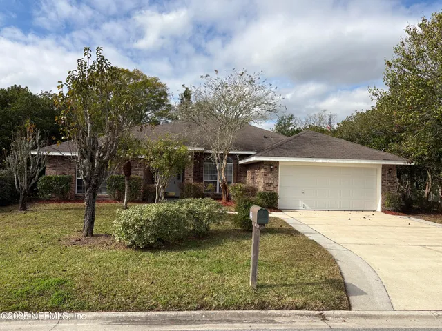 a house view with a backyard space