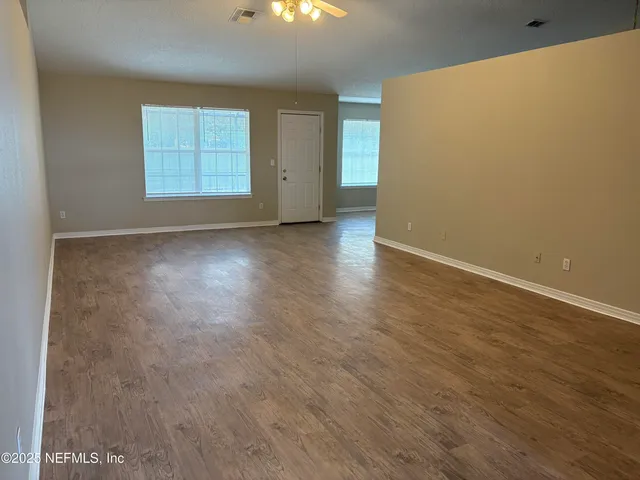 an empty room with windows