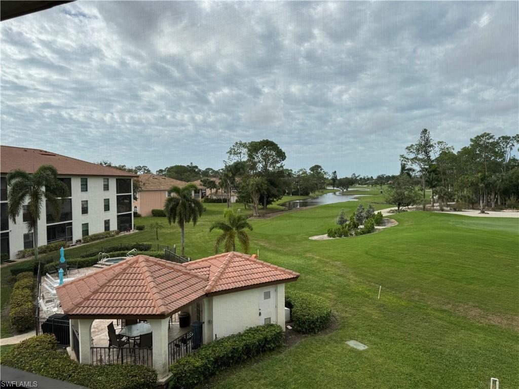 605 Augusta Boulevard, Unit 14 Naples, FL 34113 - Photo 12 of 19 View / Pool Area / Golf Course