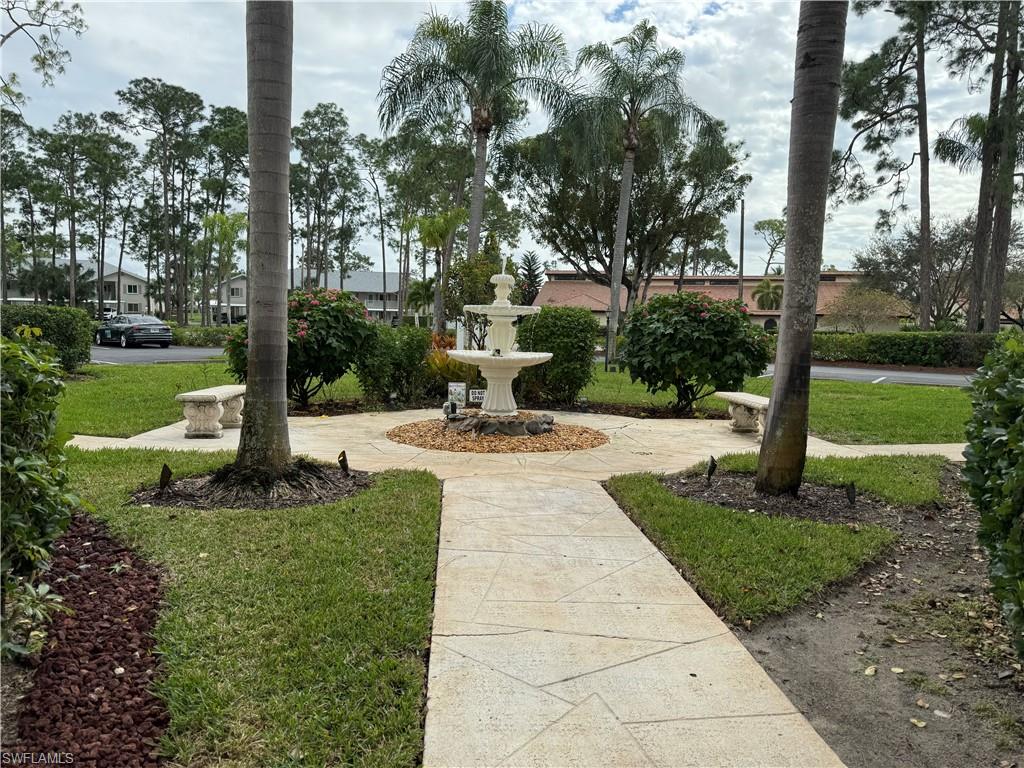 605 Augusta Boulevard, Unit 14 Naples, FL 34113 - Photo 13 of 19 Community Walk Way