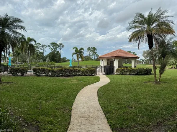 a view of a garden with palm trees