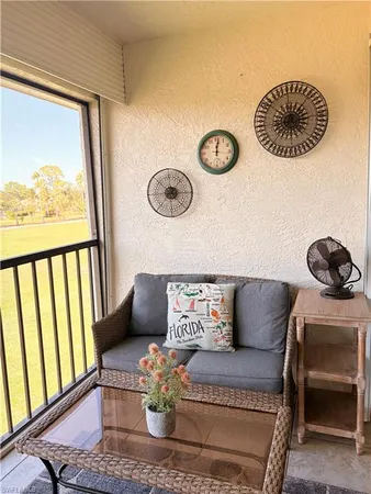 a view of kitchen with furniture and a window