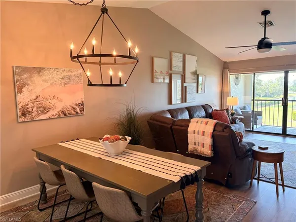 a dining room with furniture and window