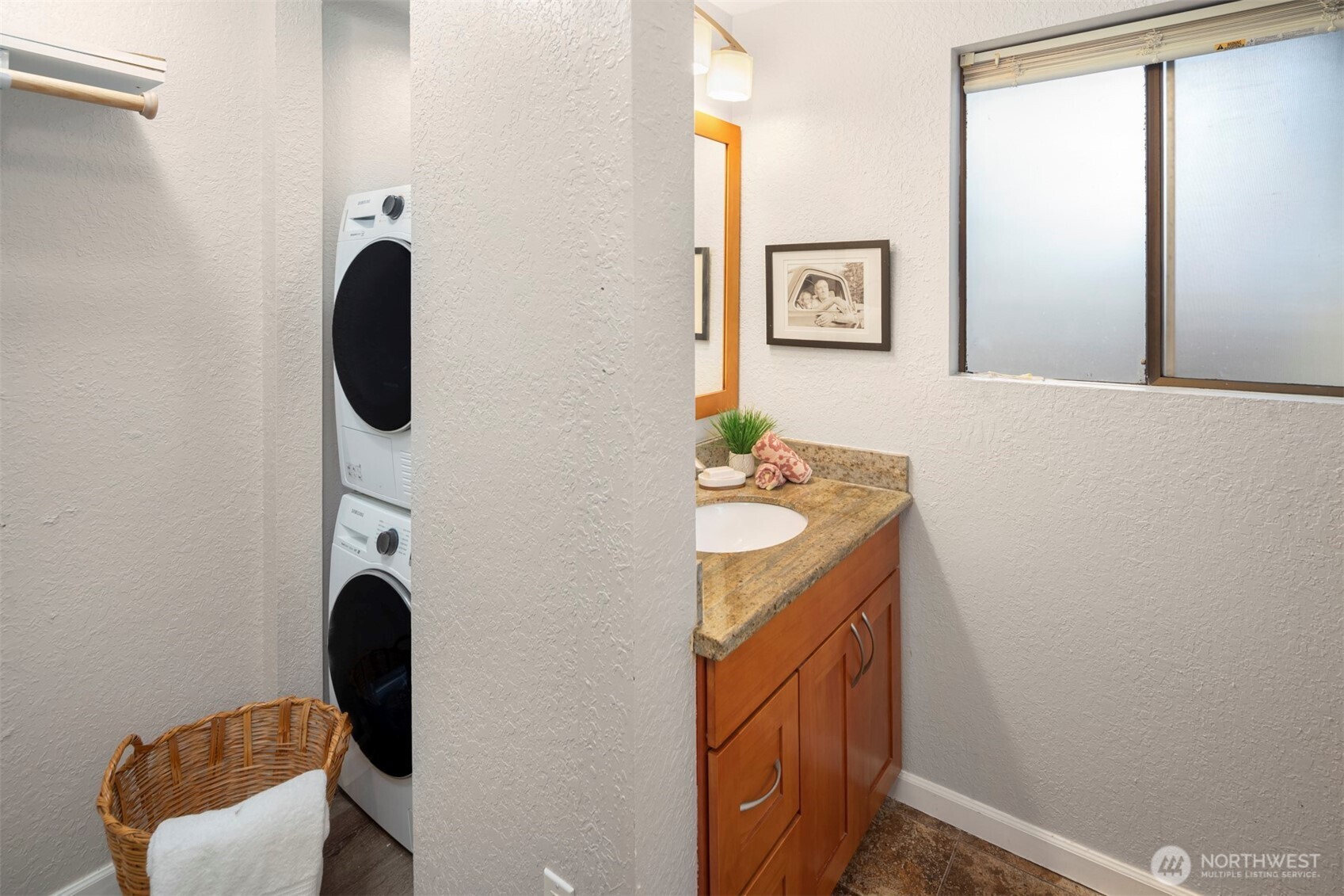 10330 Southeast 6th Street, Unit A2 Bellevue, WA 98004 - Photo 22 of 27 a bathroom with a granite countertop sink and a mirror