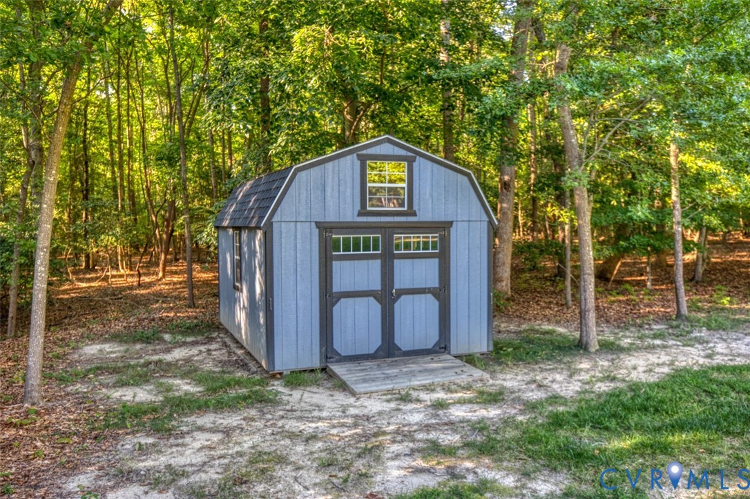 7075 Menzels Road Toano, VA 23168 - Photo 22 of 50 Barn-style storage shed featuring a gambrel roof a