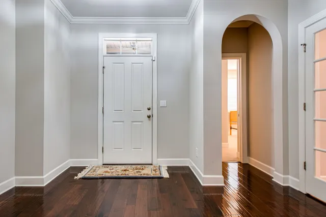 a view of front door with wooden floor