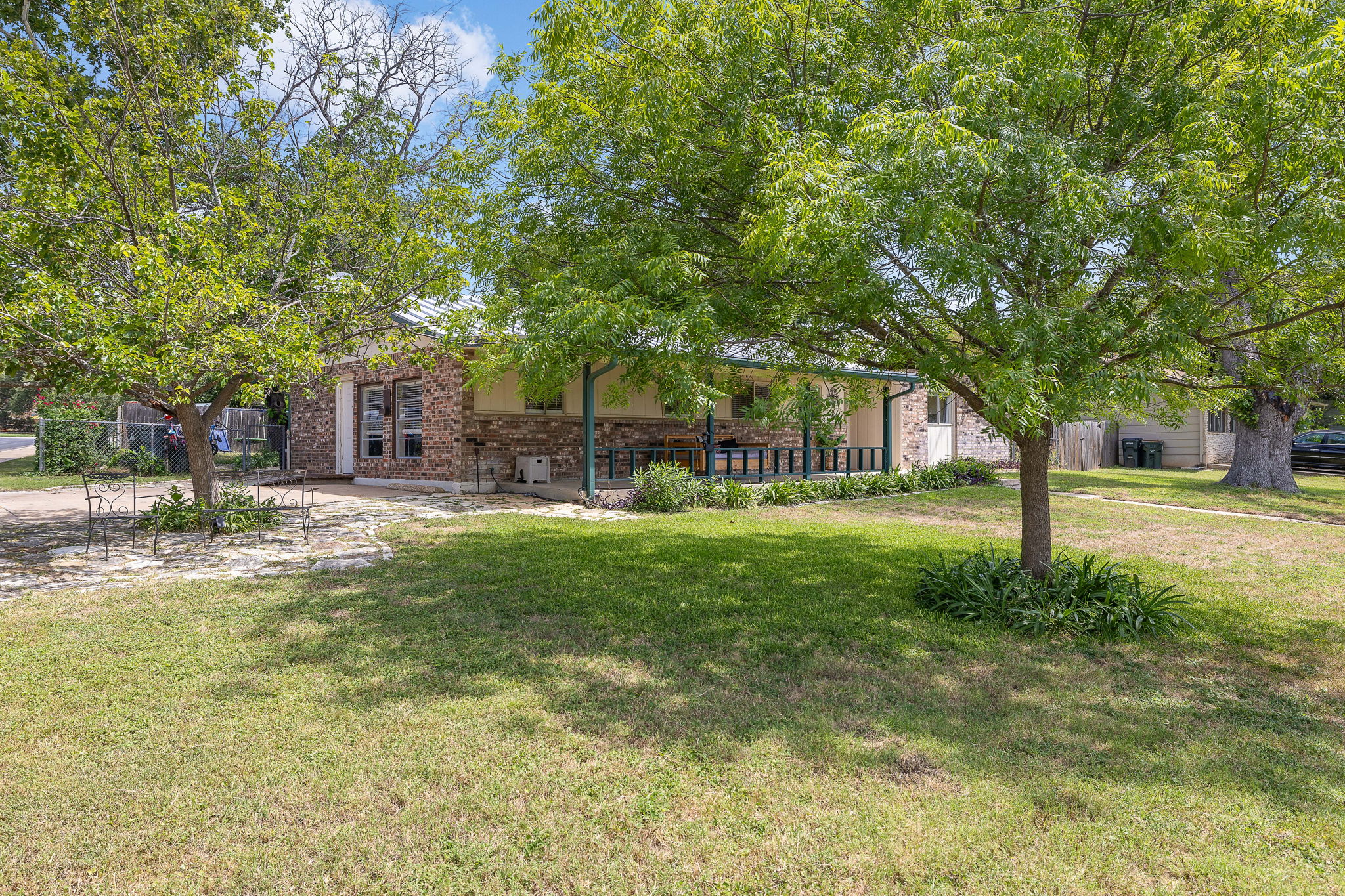 605 Parkway Street Georgetown, TX 78628 - Photo 4 of 31 Large, established trees create a beautiful canopy for the front and back yard.