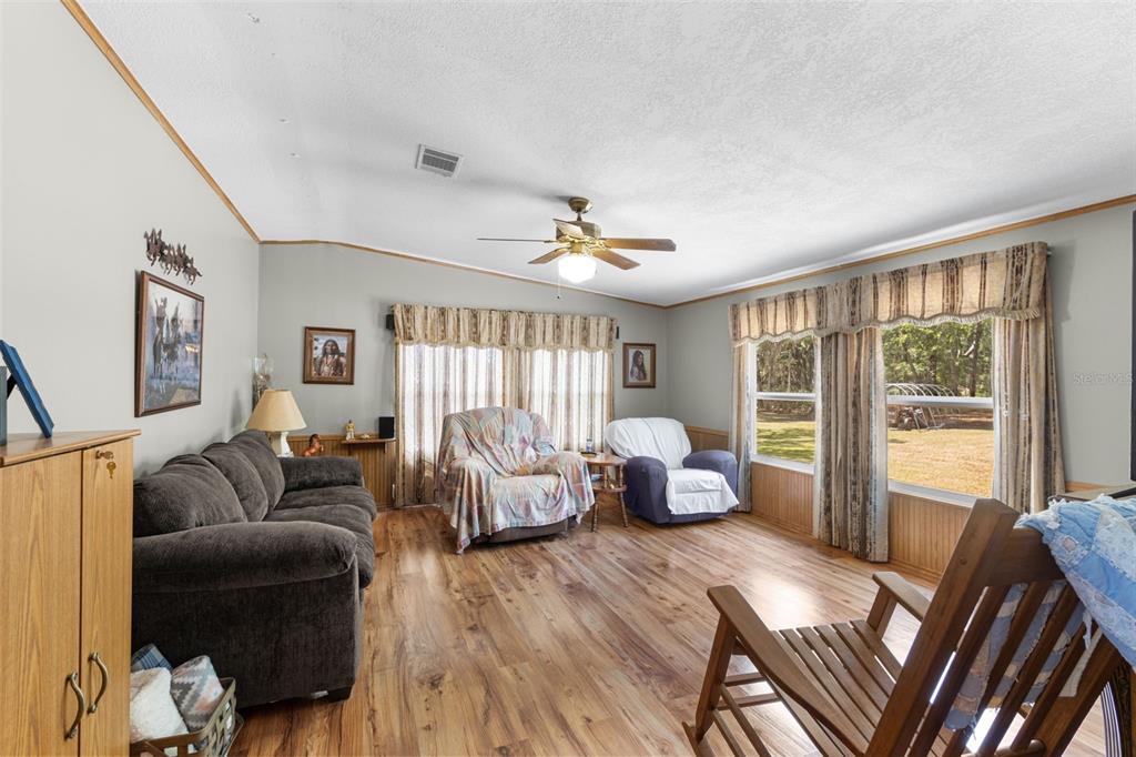 6689 Southeast 55th Street Trenton, FL 32693 - Photo 16 of 83 a living room with furniture and a large window