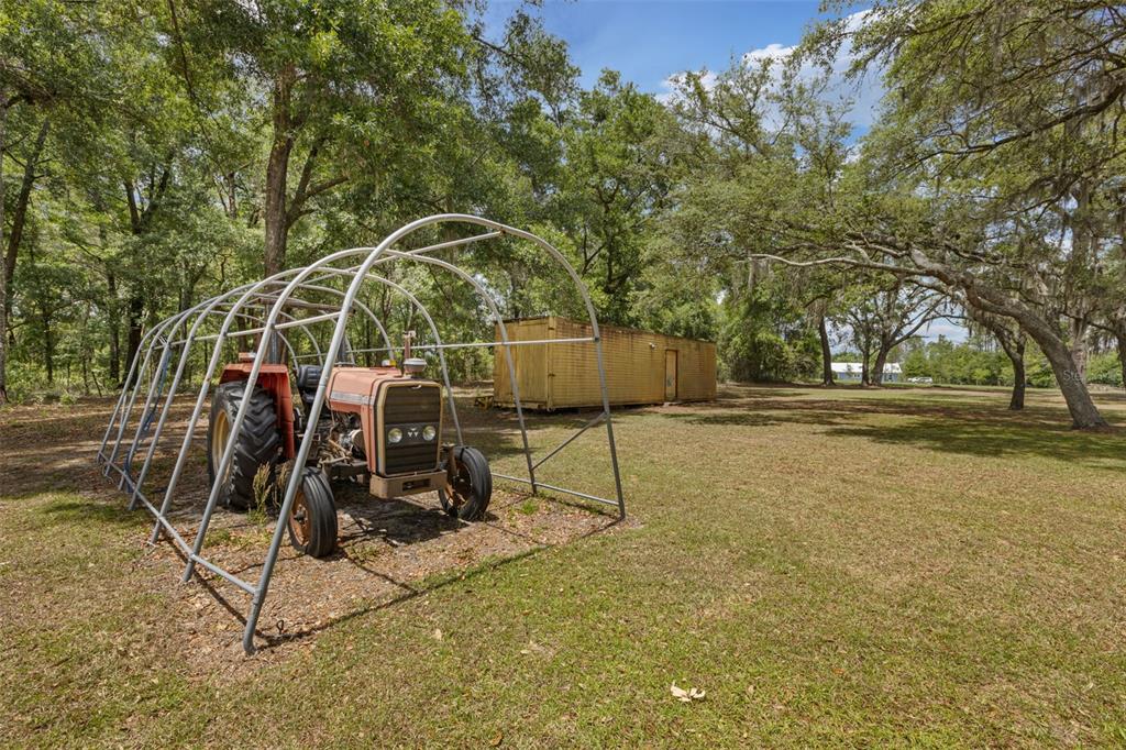 6689 Southeast 55th Street Trenton, FL 32693 - Photo 53 of 83 a view of a patio with a table and chairs
