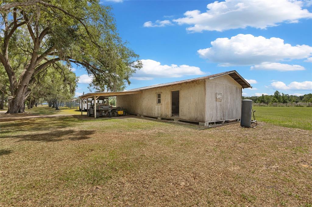 6689 Southeast 55th Street Trenton, FL 32693 - Photo 54 of 83 a view of a house with a yard and garage