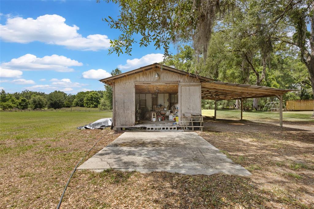 6689 Southeast 55th Street Trenton, FL 32693 - Photo 59 of 83 a view of a house with backyard and sitting area
