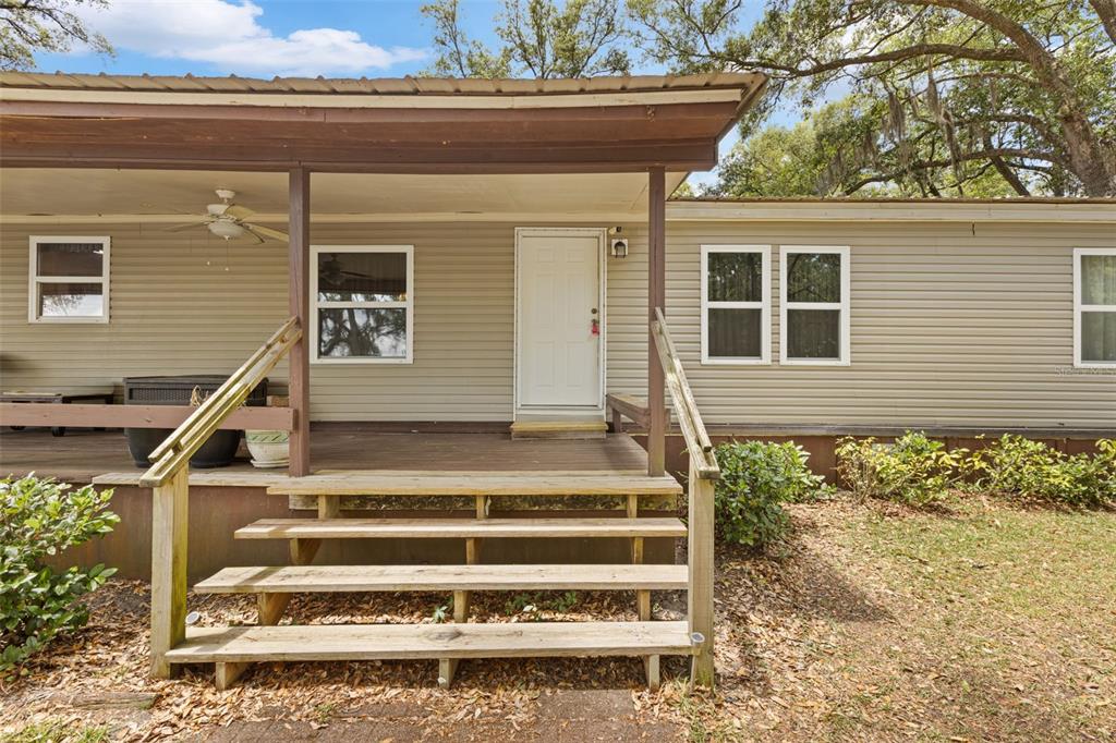 6689 Southeast 55th Street Trenton, FL 32693 - Photo 64 of 83 a front view of a house with a street