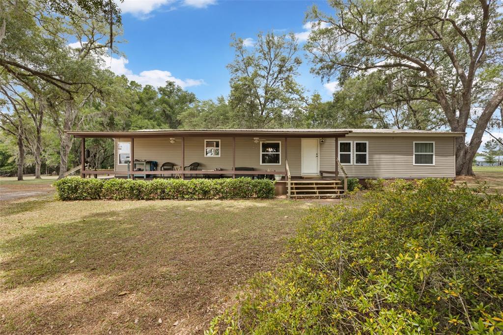 6689 Southeast 55th Street Trenton, FL 32693 - Photo 67 of 83 a front view of house with yard and green space