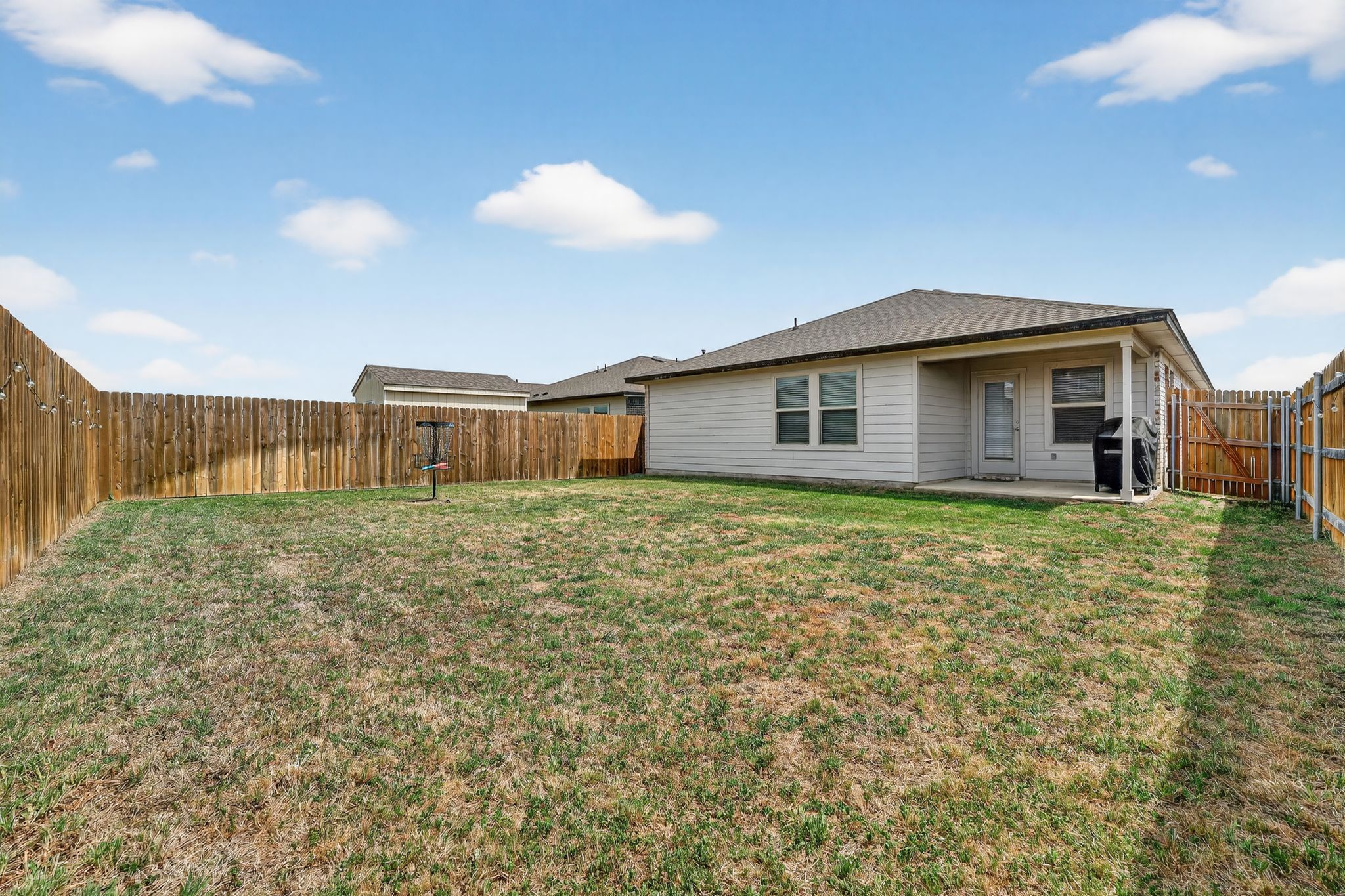 117 Halford Road Georgetown, TX 78633 - Photo 31 of 31 Rear view of property featuring a patio and a fenced backyard