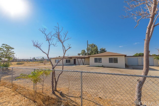 15211 Cholame Road Victorville, CA 92392 - Photo 1 of 1 a view of a house with a yard and sitting area