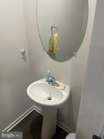 a bathroom with a sink and mirror