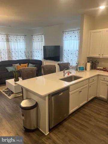 a kitchen that has a sink and a stove in it