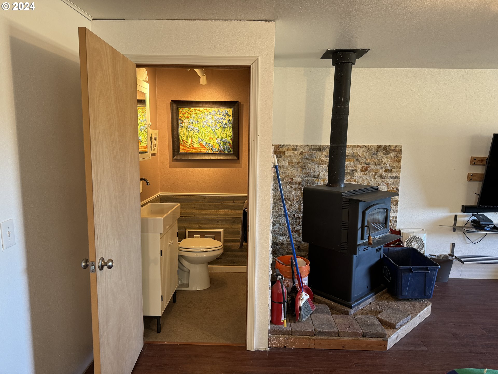 19 Newton Road Centerville, WA 98613 - Photo 27 of 48 a view of a hallway with wooden floor and a bathroom view