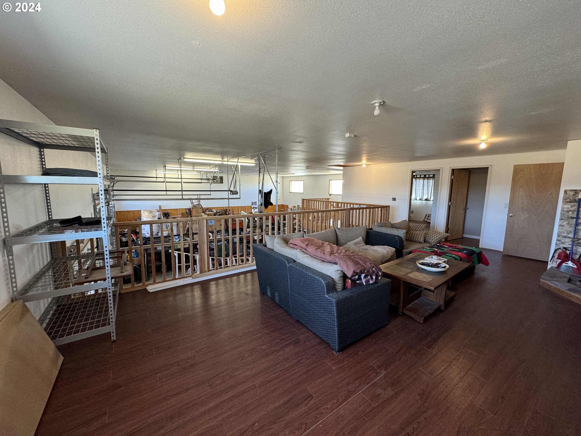 19 Newton Road Centerville, WA 98613 - Photo 30 of 48 a living room with lots of wooden furniture and a large window