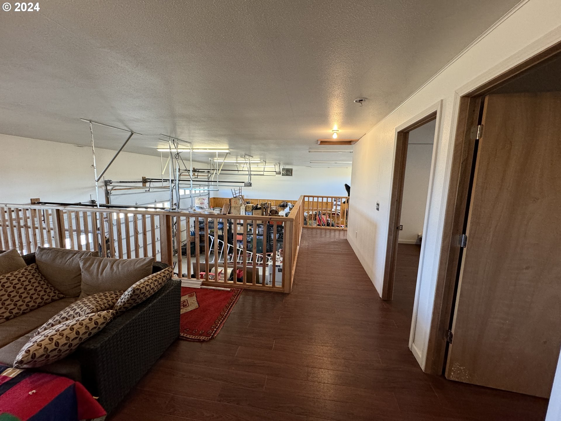 19 Newton Road Centerville, WA 98613 - Photo 32 of 48 a living room with lots of furniture and wooden floor