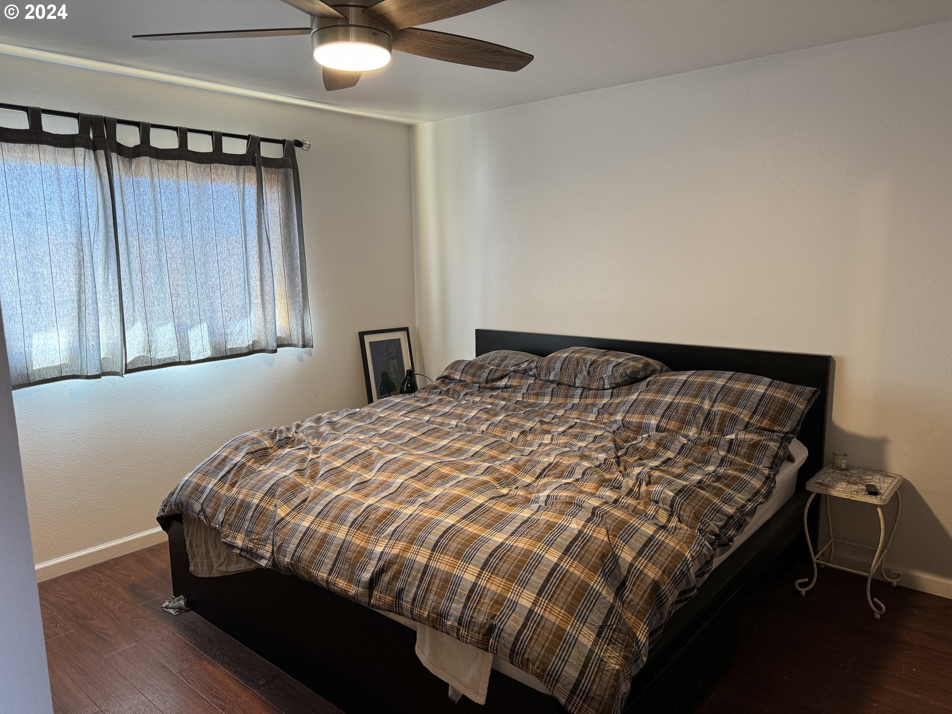 19 Newton Road Centerville, WA 98613 - Photo 34 of 48 a bed sitting in a bedroom next to a window