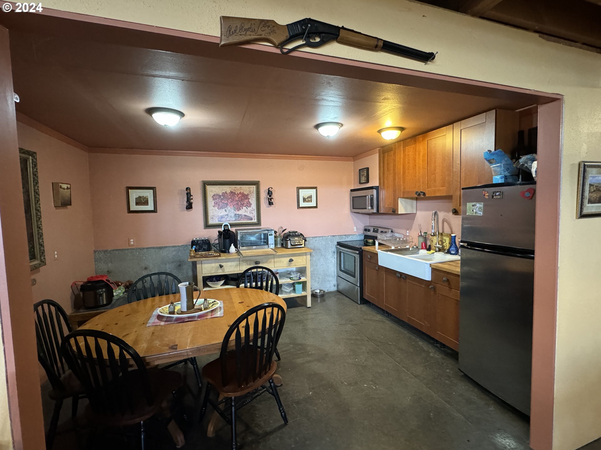 19 Newton Road Centerville, WA 98613 - Photo 5 of 48 a kitchen with a table chairs sink and cabinets
