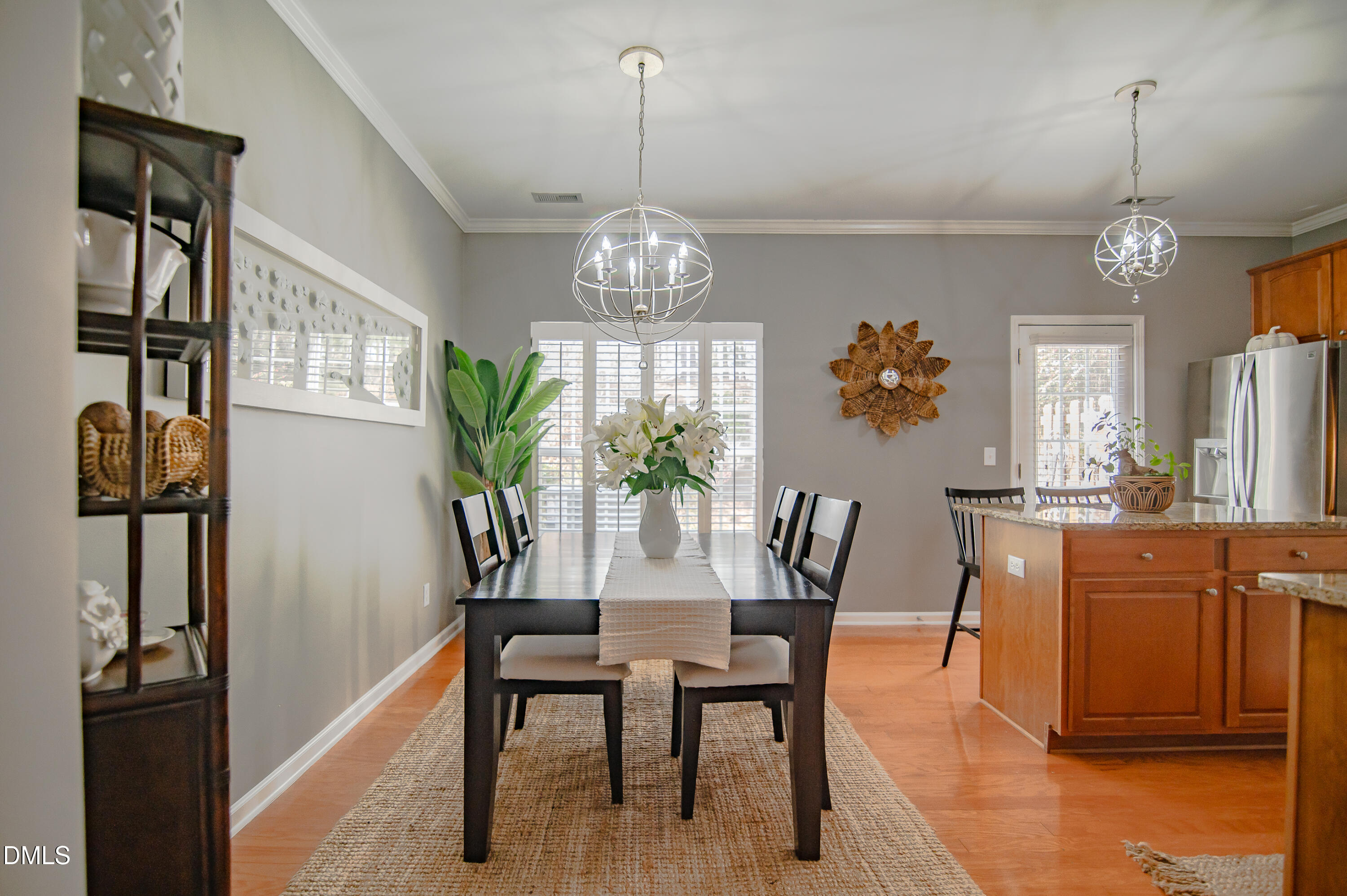 2933 Winding Waters Way Raleigh, NC 27614 - Photo 11 of 24 a view of a dining room with furniture window and wooden floor