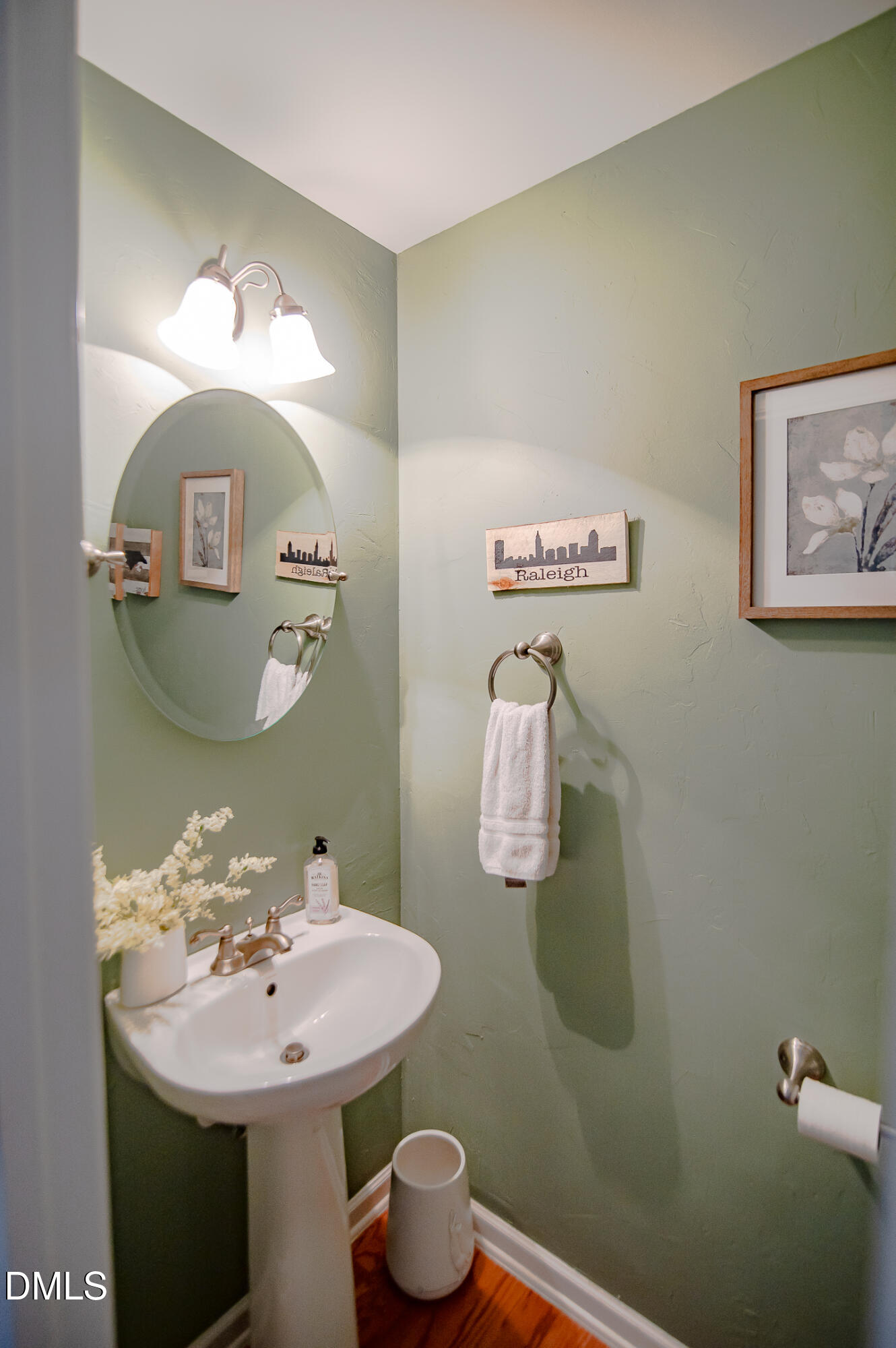 2933 Winding Waters Way Raleigh, NC 27614 - Photo 13 of 24 a bathroom with a sink mirror and toilet