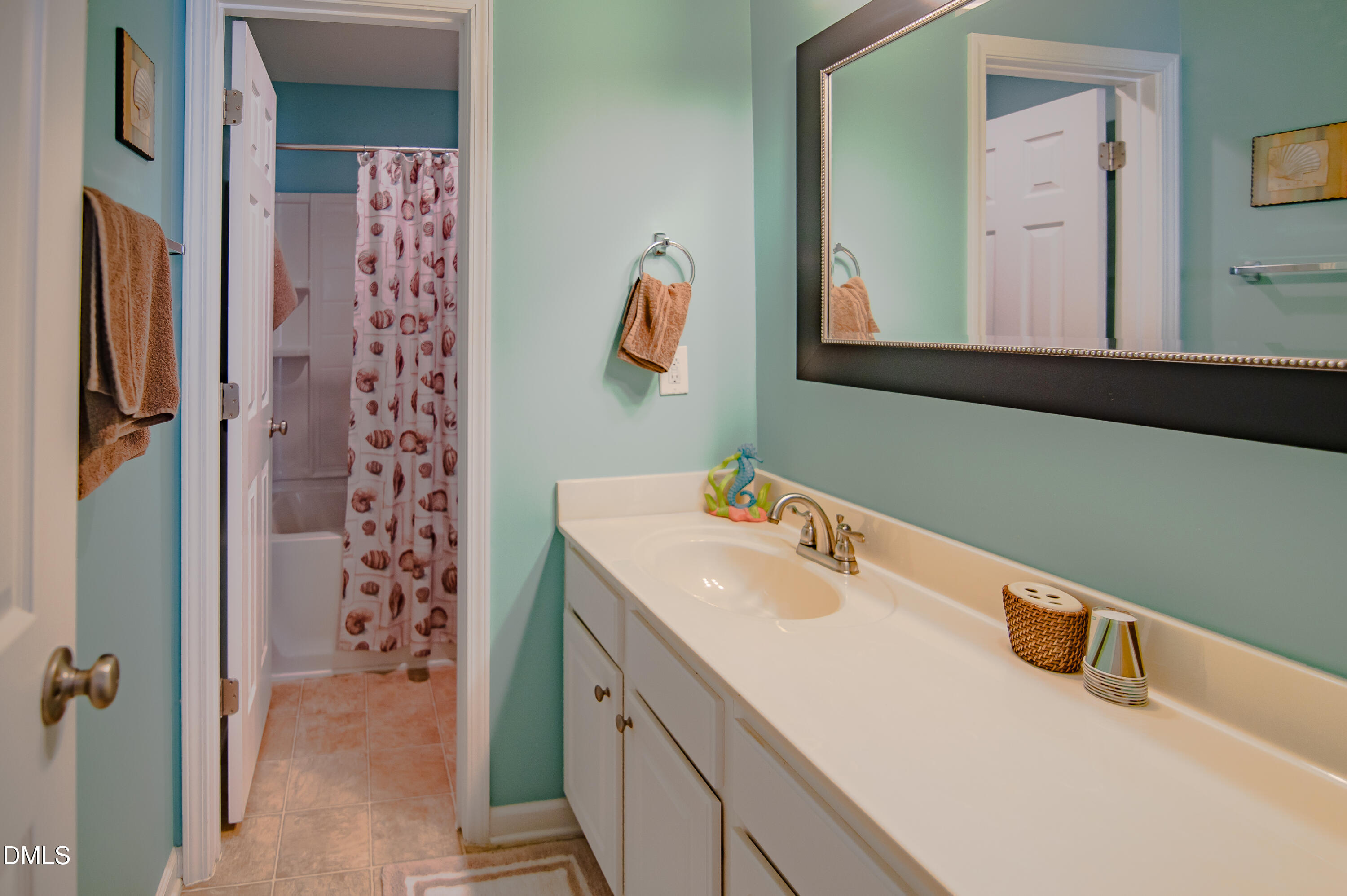 2933 Winding Waters Way Raleigh, NC 27614 - Photo 16 of 24 a bathroom with a sink vanity and a mirror