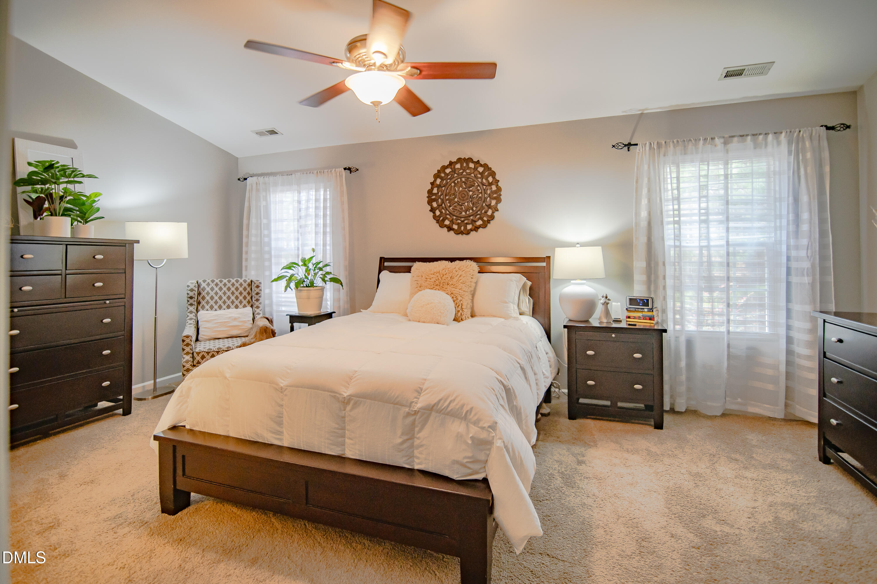 2933 Winding Waters Way Raleigh, NC 27614 - Photo 18 of 24 a bedroom with a bed and a chandelier