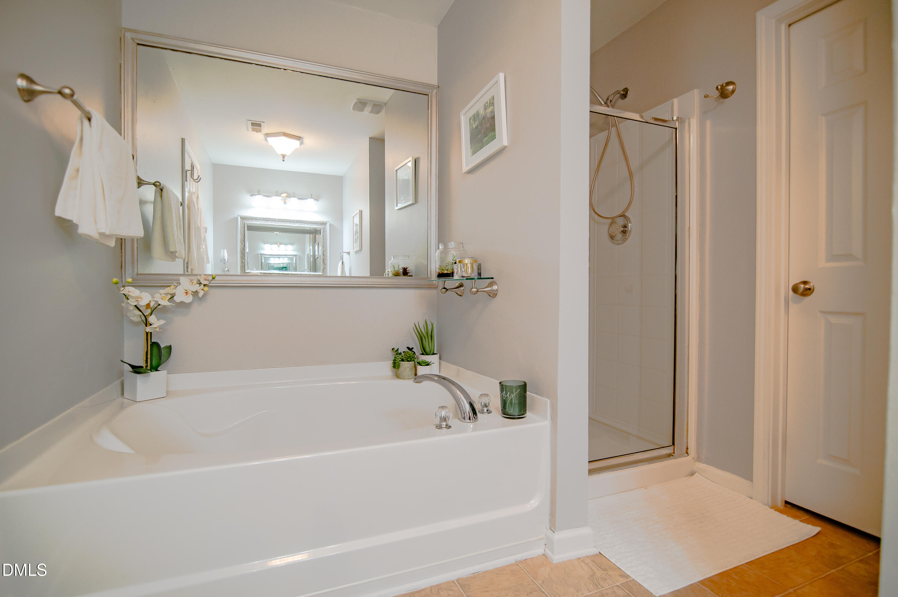 2933 Winding Waters Way Raleigh, NC 27614 - Photo 20 of 24 a white bath tub sitting next to a shower